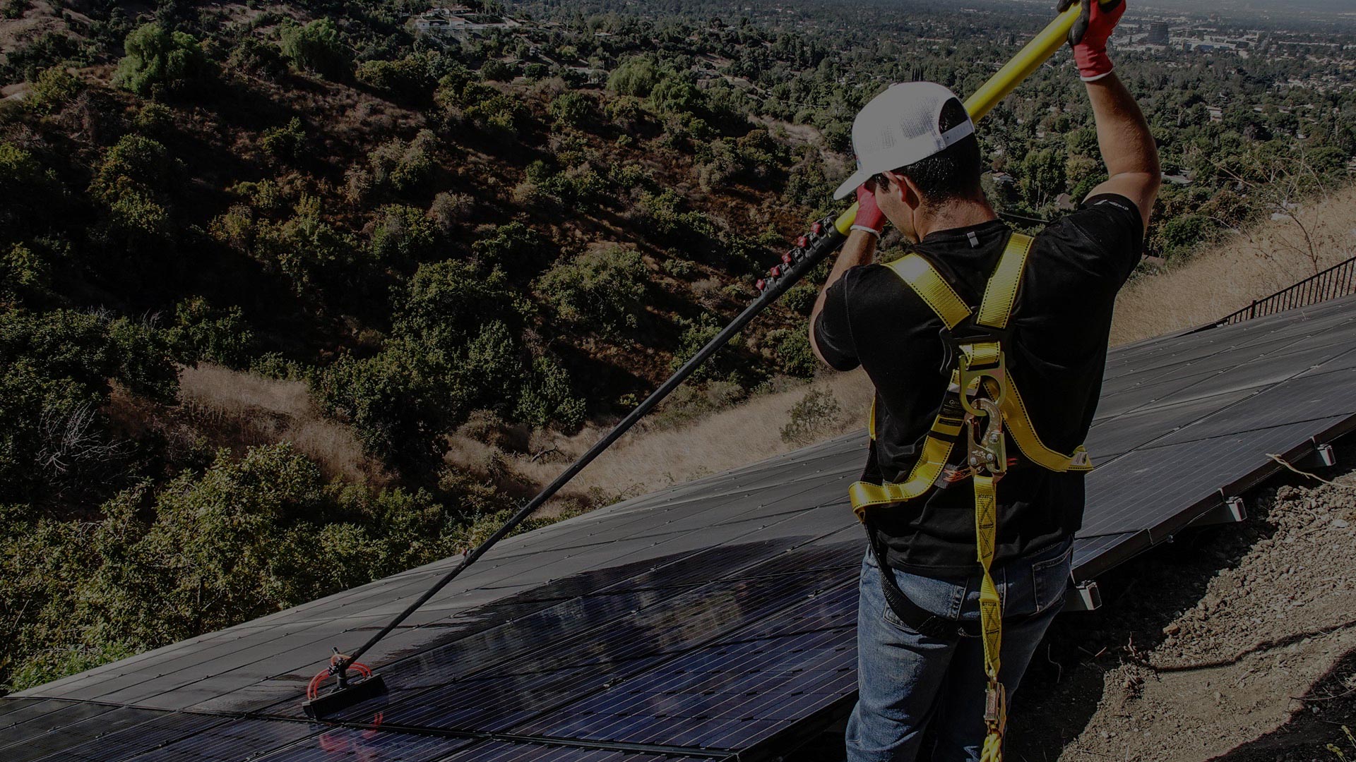 Man Cleaning Solar Panels