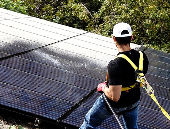 Another Man Cleaning Solar Panels
